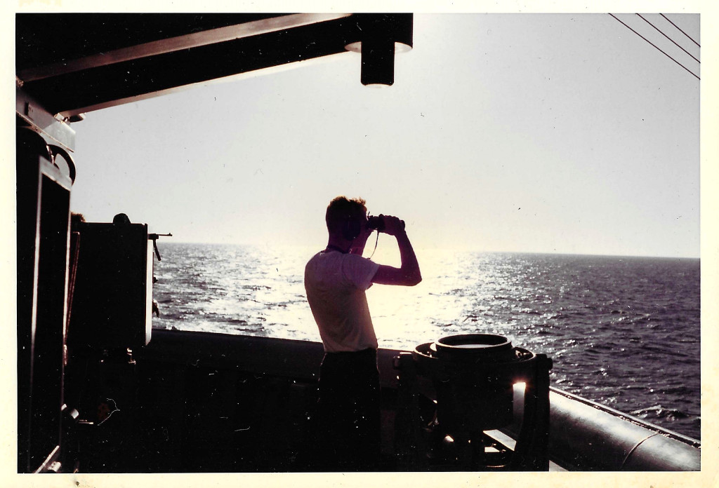 Sailor standing watch at sea